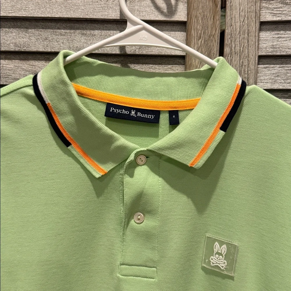 118. Psycho Bunny Light Green men’s Polo with Orange Accents, pre owned size. 6